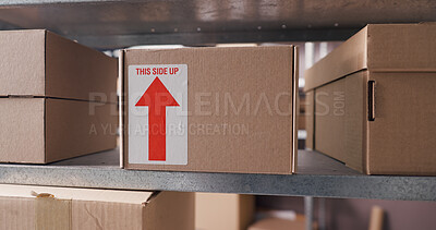 Buy stock photo Boxes, sign and shelves in factory, distribution and startup with warning label. Empty, cardboard or packaging in warehouse, ecommerce or symbol with icon, logistics or parcel with stock or inventory