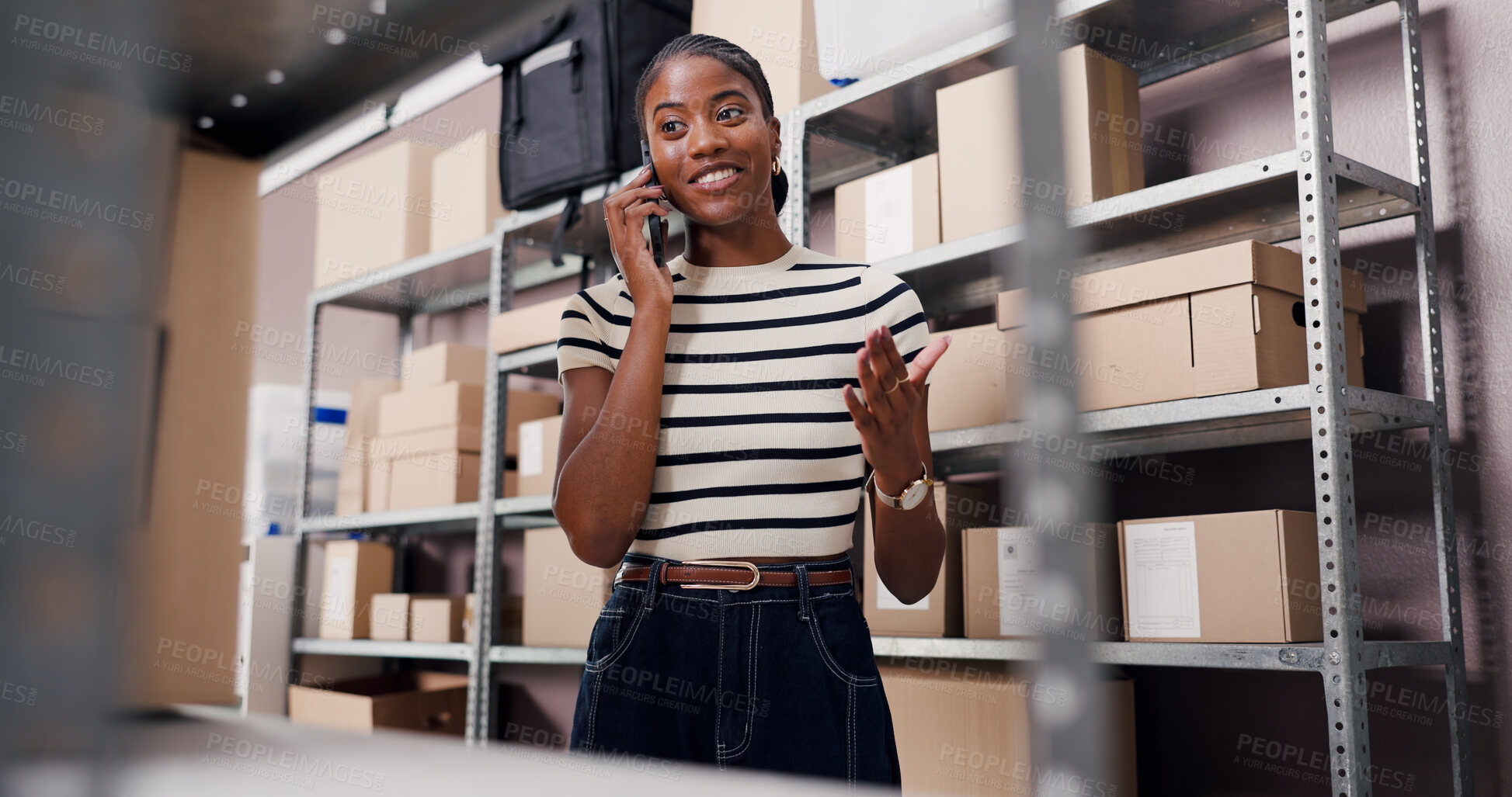 Buy stock photo Below, black woman and phone call for logistics in warehouse for schedule, chat or contact supplier. Person, mobile and talking for shipping order, supply chain and customer inquiry for distribution