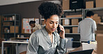 Phone call, laptop and black woman in office with logistics, ecommerce or online order confirmation. Computer, cellphone and African female entrepreneur on mobile discussion for distribution service.