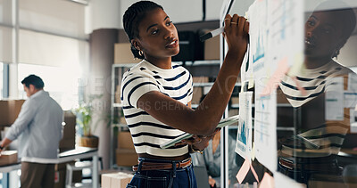 Buy stock photo Woman, writing or brainstorming with tablet at glass wall for ecommerce, logistics or shipping stats. Female person, notes and board in office with tech, supply chain strategy of distribution graphs.