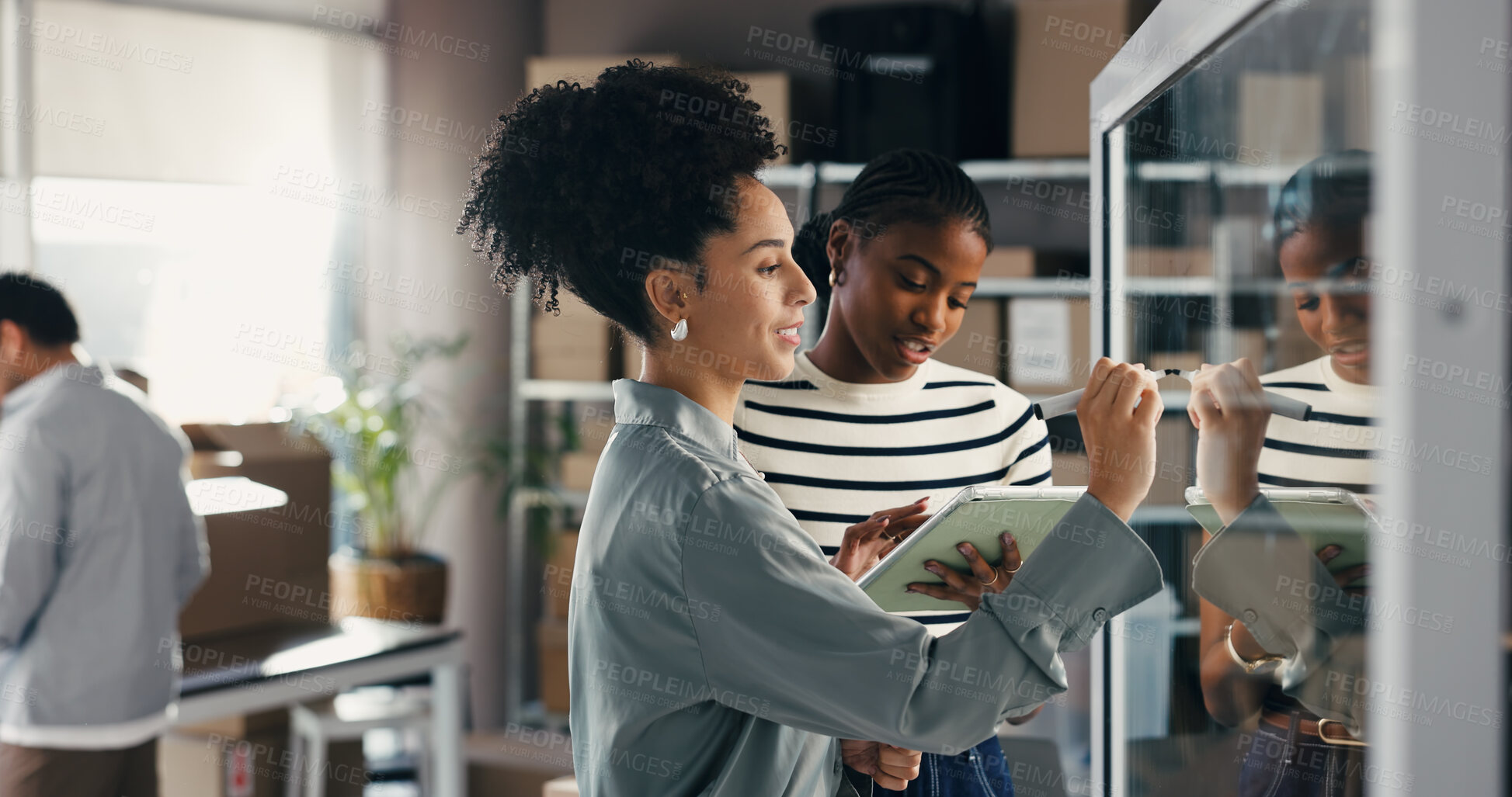 Buy stock photo People, writing and talk with tablet at glass wall for brainstorming ecommerce, logistics and shipping. Team, discussion and research in office with tech, supply chain strategy and distribution plan.