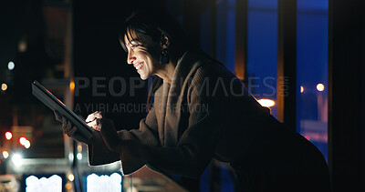 Buy stock photo Woman, tablet and night at office, balcony and smile with typing, review and check notification on break. Person, writer and happy with tech, application or overtime for project at creative agency
