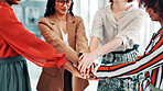 Business women, meeting and hands together with team in office for trust, mission or agreement. Female people, group or employees with pile or stack for commitment, support or unity in workplace