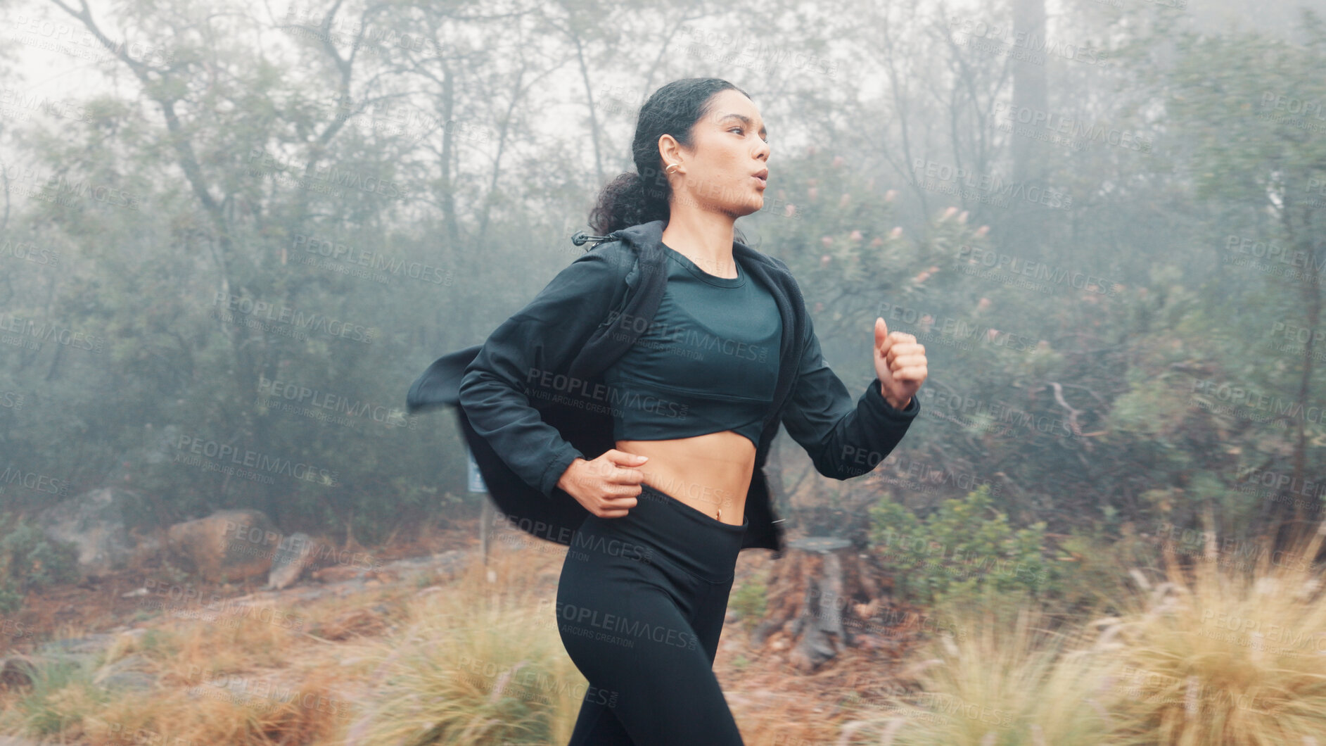 Buy stock photo Woman, running and nature with mist for fitness training, cardio exercise or outdoor workout. Active, female person or runner with sprint, race or woods for winter challenge, stamina or endurance