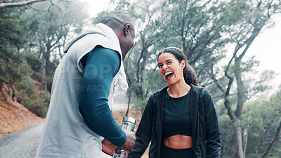 Buy stock photo Interracial couple, fitness and laughing together in nature for adventure trail, exercise and wellness. Forest, man and woman for health, cardio workout and funny joke with morning walk and bonding