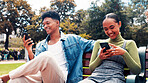 Mobile, students and friends on park bench for social media, connectivity or learning at university. Phone, man and happy woman at college campus for education app, networking online or text message