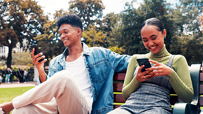 Buy stock photo Mobile, students and friends on park bench for social media, connectivity or learning at university. Phone, man and happy woman at college campus for education app, networking online or text message