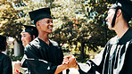Graduation, outdoor or happy people with handshake on campus, congratulations or education milestone. Achievement, goals or university student shaking hands for learning success, celebrate or friends