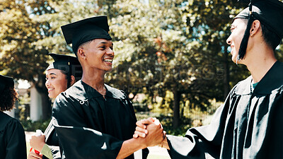 Buy stock photo Graduation, outdoor or happy people with handshake on campus, congratulations or education milestone. Achievement, goals or university student shaking hands for learning success, celebrate or friends