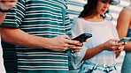 Hands, phone and text message with friends outdoor together for connection or social media browsing. App, contact and typing with group of people in line for communication, online chat or reading