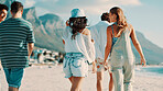Back, friends outdoor and walking on beach for bonding together, summer holiday and travel adventure. Happy, people and stroll by ocean with hangout, weekend getaway and tropical vacation activity.