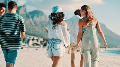 Buy stock photo Back, friends outdoor and walking on beach for bonding together, summer holiday and travel adventure. Happy, people and stroll by ocean with hangout, weekend getaway and tropical vacation activity.