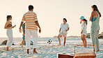People, playing and beach with ball for social gathering, fun summer or outdoor bonding in nature. Group, friends or playful community with soccer on ocean coast for vacation, holiday or weekend