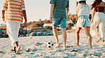 People, fitness or playing soccer on beach for vacation, fun and bonding together in nature. Men, women and legs of friends with social gathering for football game, workout and exercise on sea sand