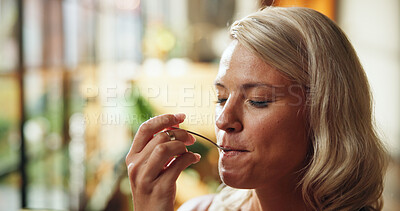 Buy stock photo Home, woman and eating with spoon for breakfast, delicious meal and flavor satisfaction for health. Hungry person, enjoy food and taste in living room for diet, nutrition and wellness with utensil