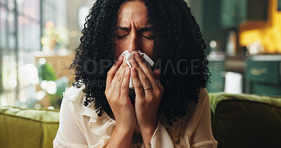 Buy stock photo Sick, blowing nose and woman on sofa with tissue, influenza and cold congestion in allergy season. Health, virus and Africa person in house with paper napkin, sneeze and viral flu in wellness risk.