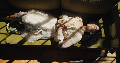 Buy stock photo Relax, peace and above of woman on sofa of home for calm, stress relief and weekend break. Comfortable, resting and chill with top view of person in living room of apartment for wellness and nap