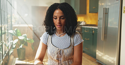 Buy stock photo Laptop, remote work and typing with woman in kitchen of home for online planning or research. Computer, email and internet with freelance employee person in apartment for small business startup
