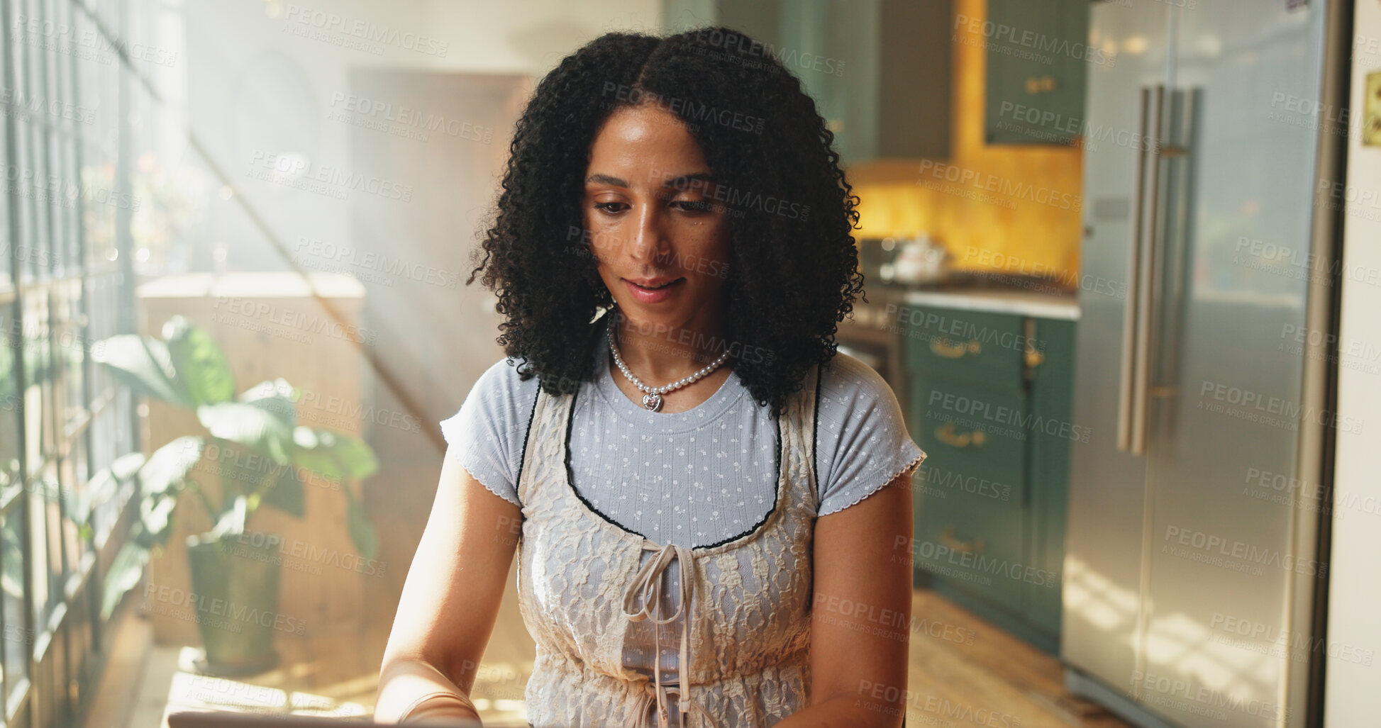 Buy stock photo Laptop, remote work and typing with woman in kitchen of home for online planning or research. Computer, email and internet with freelance employee person in apartment for small business startup