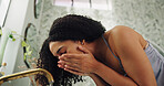 Bathroom, skincare and woman washing face by faucet, hygiene and grooming routine for morning wellness. Self care, facial cleansing or person in home for dermatology practice, tap water and low angle