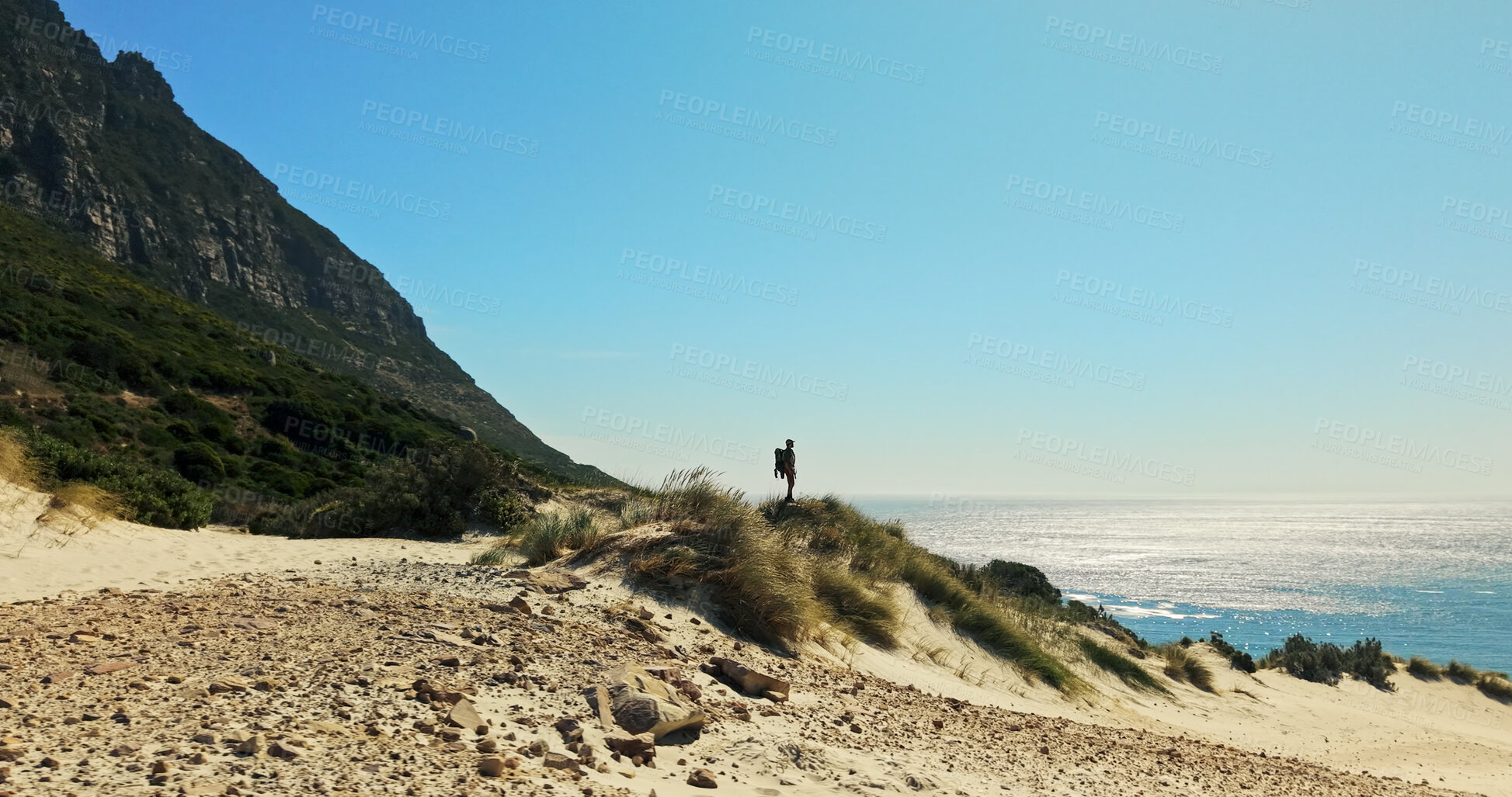 Buy stock photo Mockup, hiking and man with space for travel, adventure and fitness for journey with backpack. Male person, trekking and explore dune for exercise, eco tourism and nature for holiday or vacation