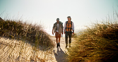 Buy stock photo Hiking, friends or men on trail with support, connection or motivation for exploration goals. Adventure, backpack or people outdoor with walk, endurance or bonding together for trekking milestone.