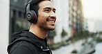 Listening, outdoor and happy man with headphones in city, streaming music or explore town for tourism. Sightseeing audio track, location podcast and person with urban info, tech or travel in New York