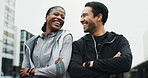 Fitness, couple and laughing with arms crossed in city for workout progress, wellness and support. Active relationship, interracial people or happy outdoor for urban exercise, bonding or cardio break