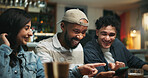 Smartphone, people and friends in pub, pointing and social gathering with communication. Men, woman and cellphone with internet, connection and digital app with website info, smile and conversation