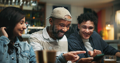 Buy stock photo Smartphone, people and friends in pub, pointing and social gathering with communication. Men, woman and cellphone with internet, connection and digital app with website info, smile and conversation