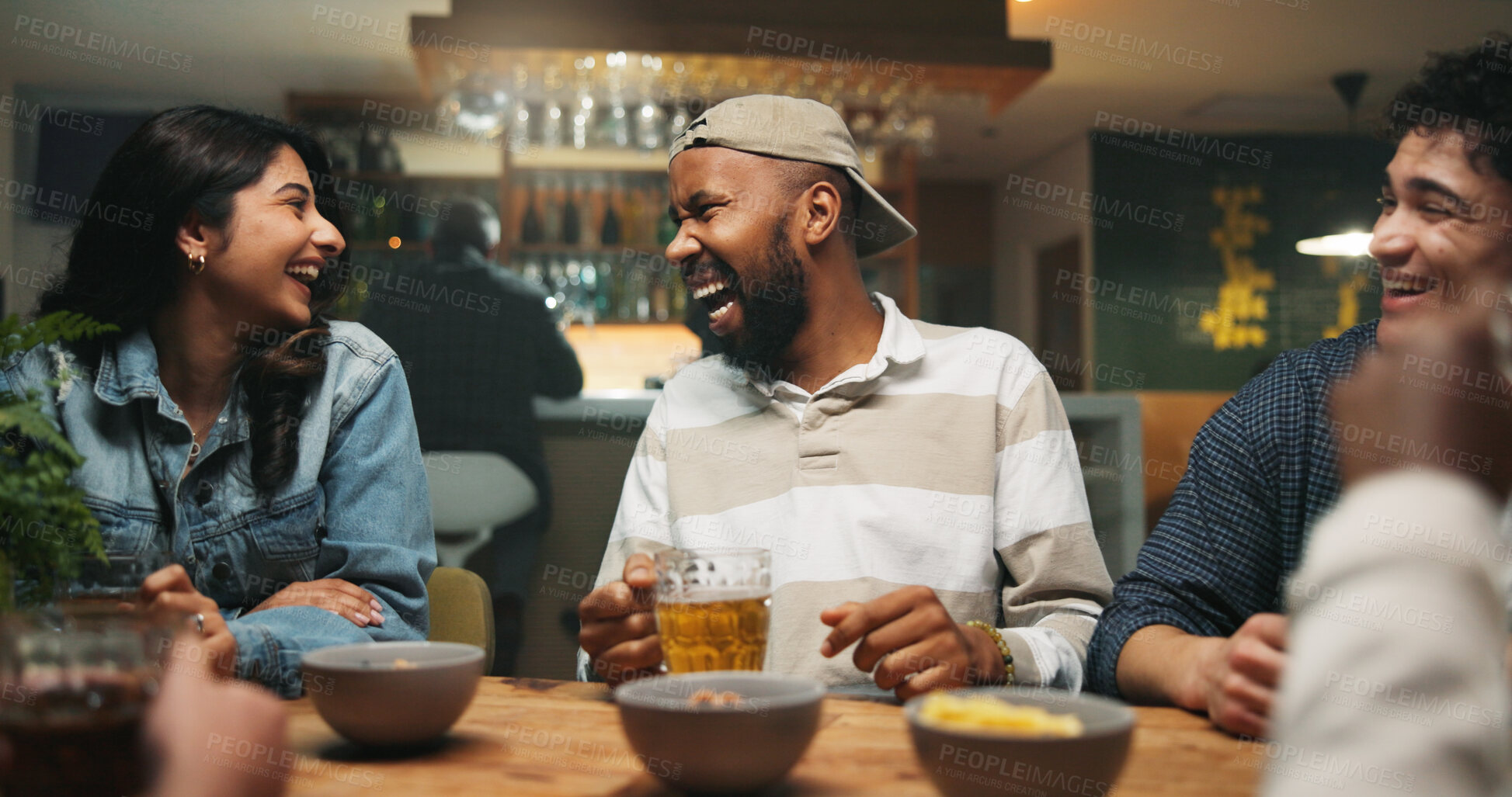 Buy stock photo Conversation, friends and people in pub, humor and bonding together with alcohol. Group, happy men and woman in restaurant, discussion and laughing with joke, funny and social gathering with beer