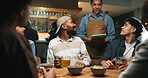 Waiter, tablet and friends order at bar, talk and option for drinks, choice and wine list. Man, server and group of people with tech, digital menu or app for customer experience with decision at pub