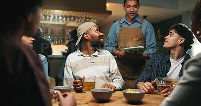 Buy stock photo Waiter, tablet and friends order at bar, talk and option for drinks, choice and wine list. Man, server and group of people with tech, digital menu or app for customer experience with decision at pub