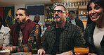 Anxiety, watching tv and people in pub for sports game with championship for entertainment together. Stress, live streaming and group of friends with football match in bar for online tournament.