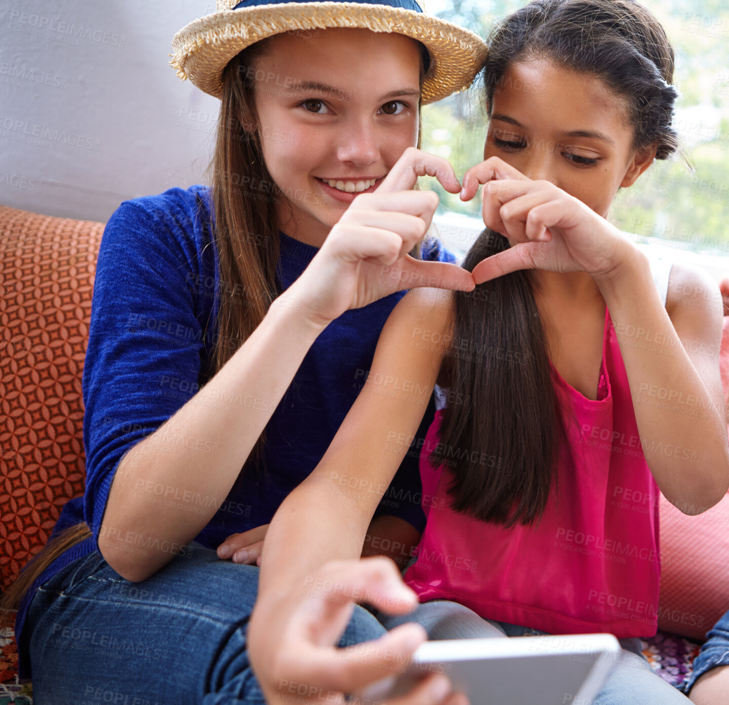 Buy stock photo Teenager, selfie and friends with heart hands on sofa for social media, bonding and reunion in living room. Tech, girls and online app with profile picture, gesture with love on couch in apartment