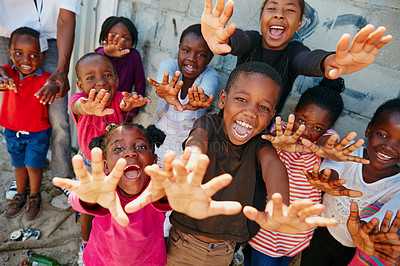 Buy stock photo Portrait, outreach and excited with children outdoor for youth drive, community service or welfare project. Rural charity program, poverty and social responsibility with group of kids in neighborhood