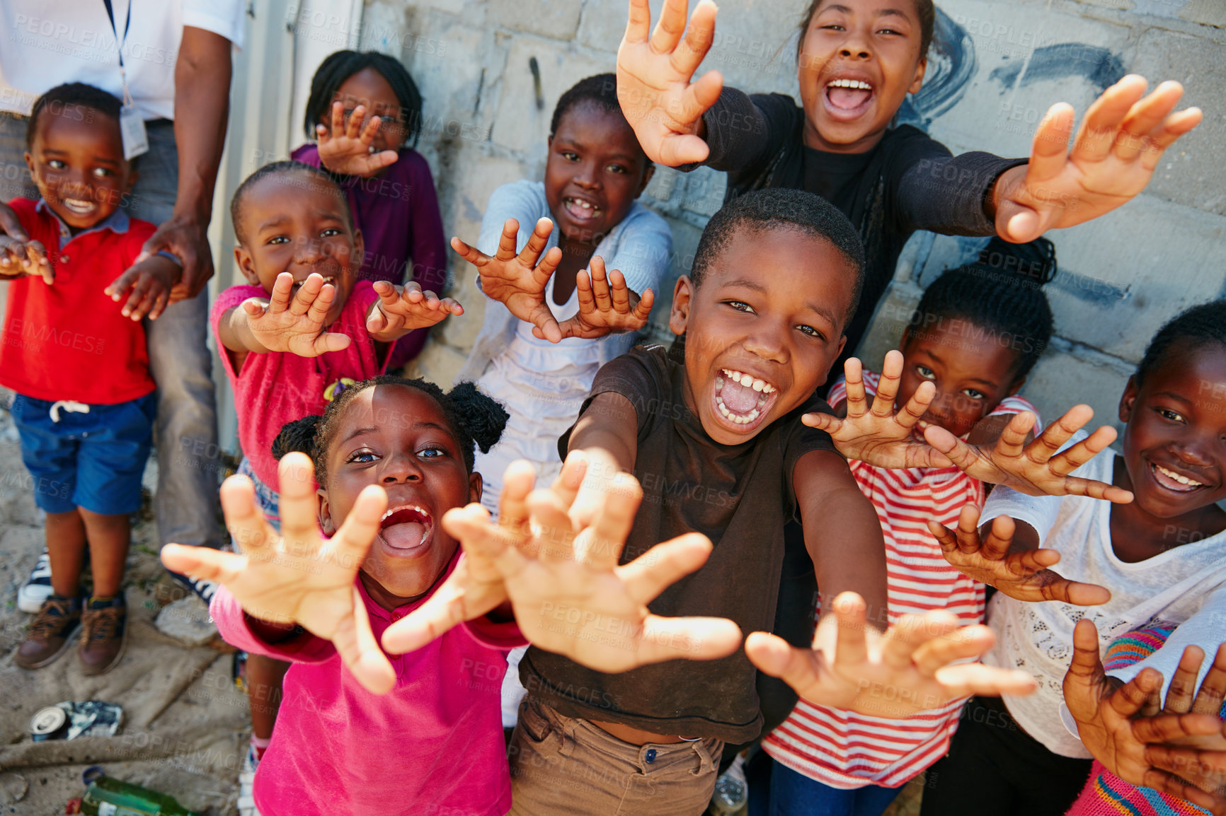 Buy stock photo Portrait, outreach and excited with children outdoor for youth drive, community service or welfare project. Rural charity program, poverty and social responsibility with group of kids in neighborhood