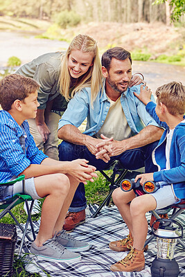 Buy stock photo Camping, family and children with picnic, conversation and vacation in countryside. Parents, kids and forest for weekend break, trip or holiday for summer travel at campsite together in woods