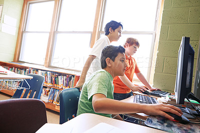 Buy stock photo Boy, kids and learning in school with computer for digital literacy, education and skill development. Children, classmates and browse with desktop in library for homework, tech knowledge or research.