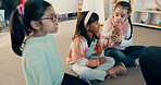 Students, girl and children on floor in classroom for reading group, learning and academic development. Kindergarten, kids and learner on ground at school for study activity, education or scholarship