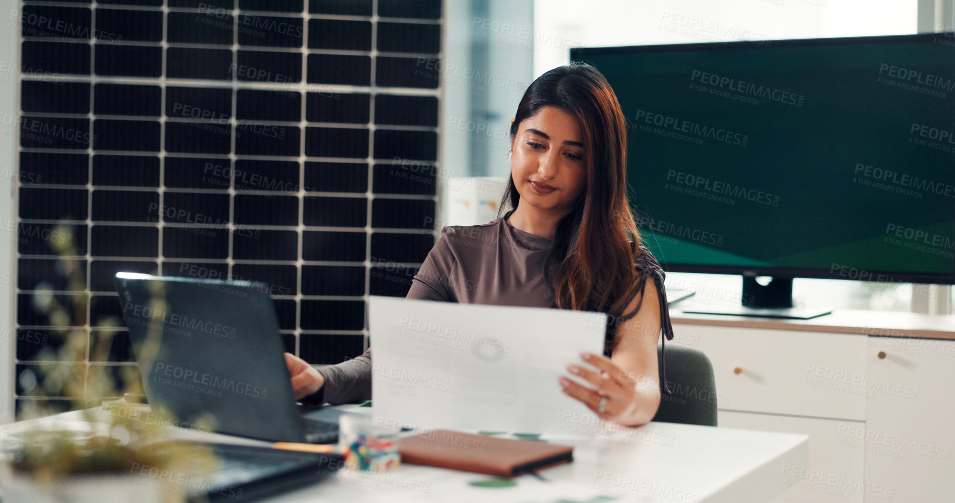 Buy stock photo Business, woman and reading document in office for results, energy saving stats and sustainable. Person, laptop and paperwork with photovoltaic grid revenue, company performance and solar panel sales