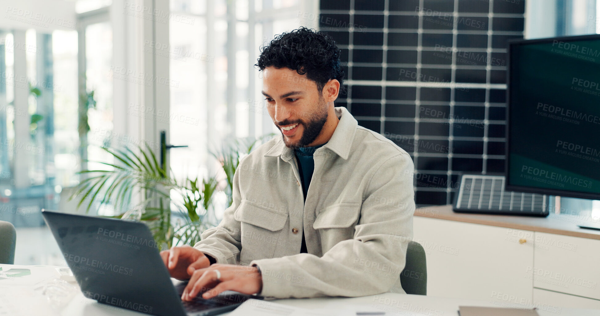 Buy stock photo Smile, solar panels and man in office, laptop and planning with research for sustainability. Happy person, pc and employee with photovoltaic grid, internet and feedback for ecology report or email