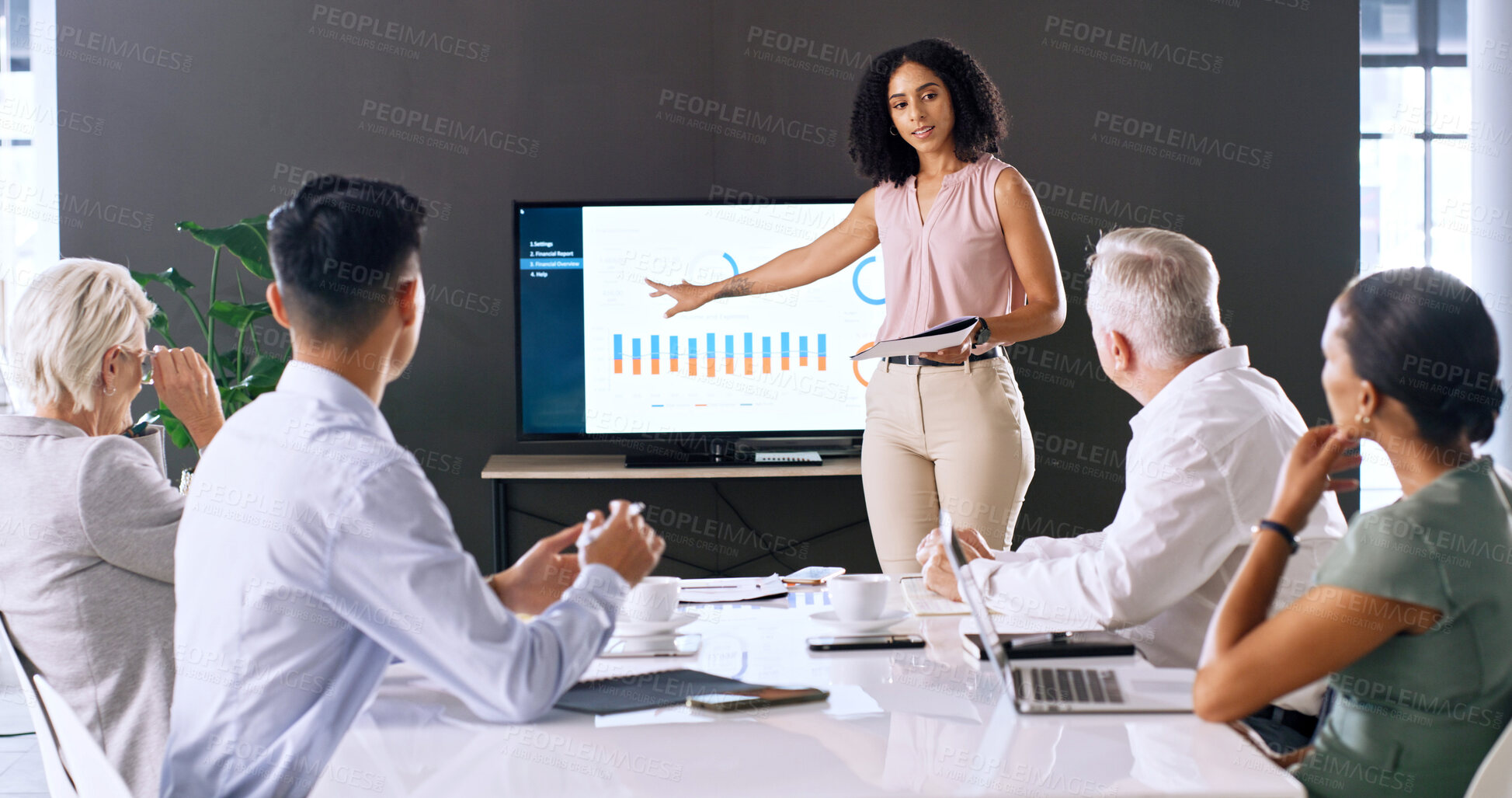 Buy stock photo Screen, business woman and presentation with graphs in meeting for finance, metrics or paperwork. Presenter, monitor and team in office with data for investment analysis, KPI or performance document