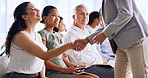 Business woman, smile and handshake at seminar for greeting, meeting or thank you for introduction. Team, people and shaking hands at conference for hello, networking and welcome to office workshop