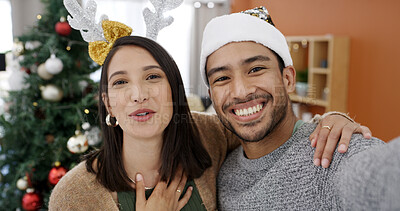 Buy stock photo Christmas, portrait and video call with happy couple in living room of home together for celebration. Hello, smile and streaming with people in apartment for festive communication or tradition