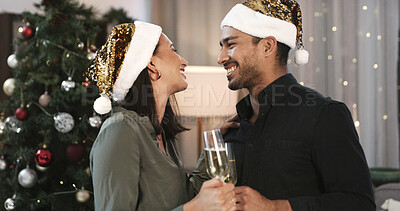 Buy stock photo Christmas, happy couple or love in home with champagne for holiday tradition, care or bonding together. Married people, alcohol drink and smile in living room for festive season, connection and xmas.