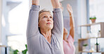 Elderly woman, fitness and stretching with yoga class for spiritual wellness or balance together. Senior people, yogi and coaching in warrior pose for warm up, mindfulness or retirement exercise