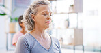 Yoga class, senior woman and meditation for calm, mindfulness or fitness with breathing exercise. Yogi, spiritual wellness or person with friends in studio, zen or balance with eyes closed for health