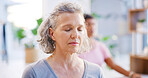 Yoga class, mature woman and meditation for mindfulness, fitness or breathing exercise for peace. Yogi, spiritual wellness and person with friends in studio, zen or holistic health with balance