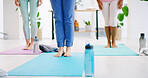 Yoga class, people and feet on mat in studio, start balance routine or posture exercise for wellness. Spiritual activity, yogi or legs of group together to begin workout, fitness and holistic healing